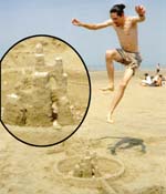 Vince demolishing sand castle at Zandvoort beach