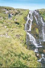 Reto at a waterfall on the Isle of Skye