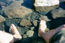 Vince's painted toenails (from prague) in river dividing the two mountain ranges on the Isle of Skye