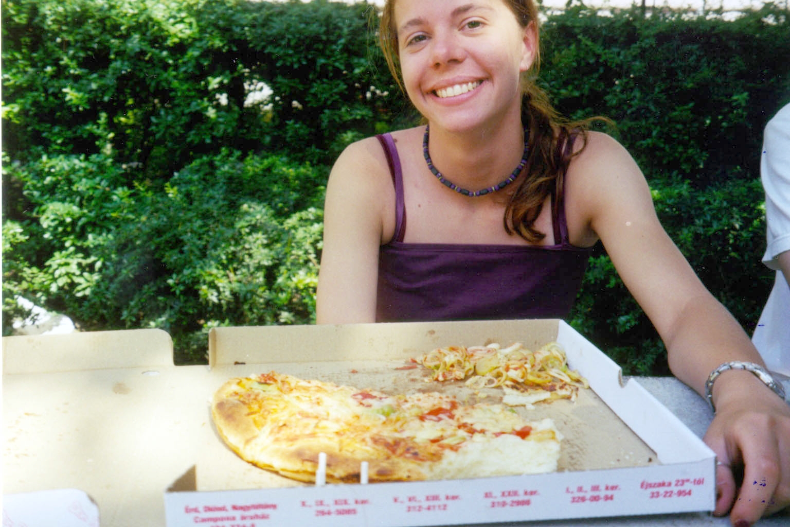 Debbie snacking on pizza in Budda Pest