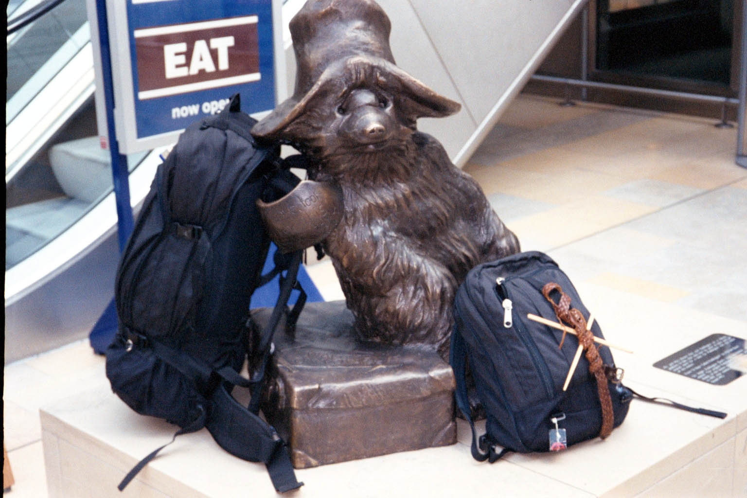 Paddington Bear holding my backpack
