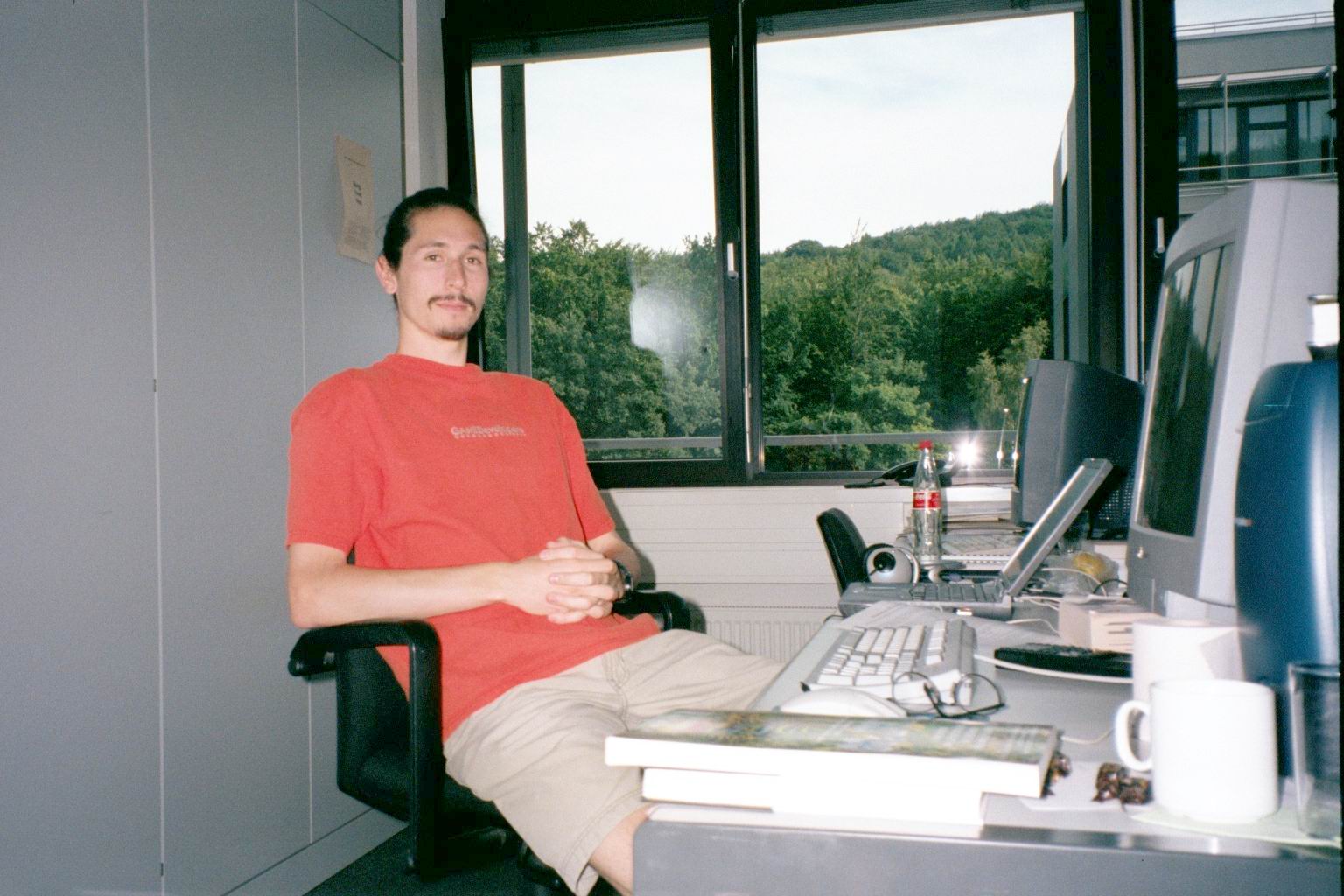 Vince sits at his office desk