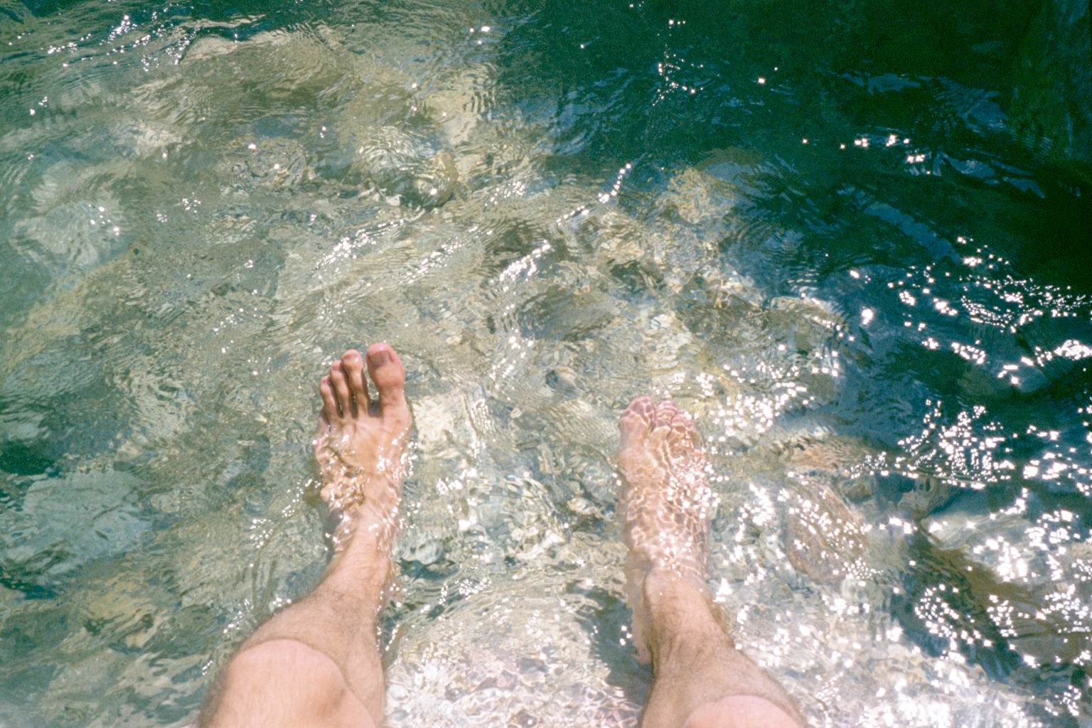 My feets in the rather cold mountain stream near Castle Neuschwanstein