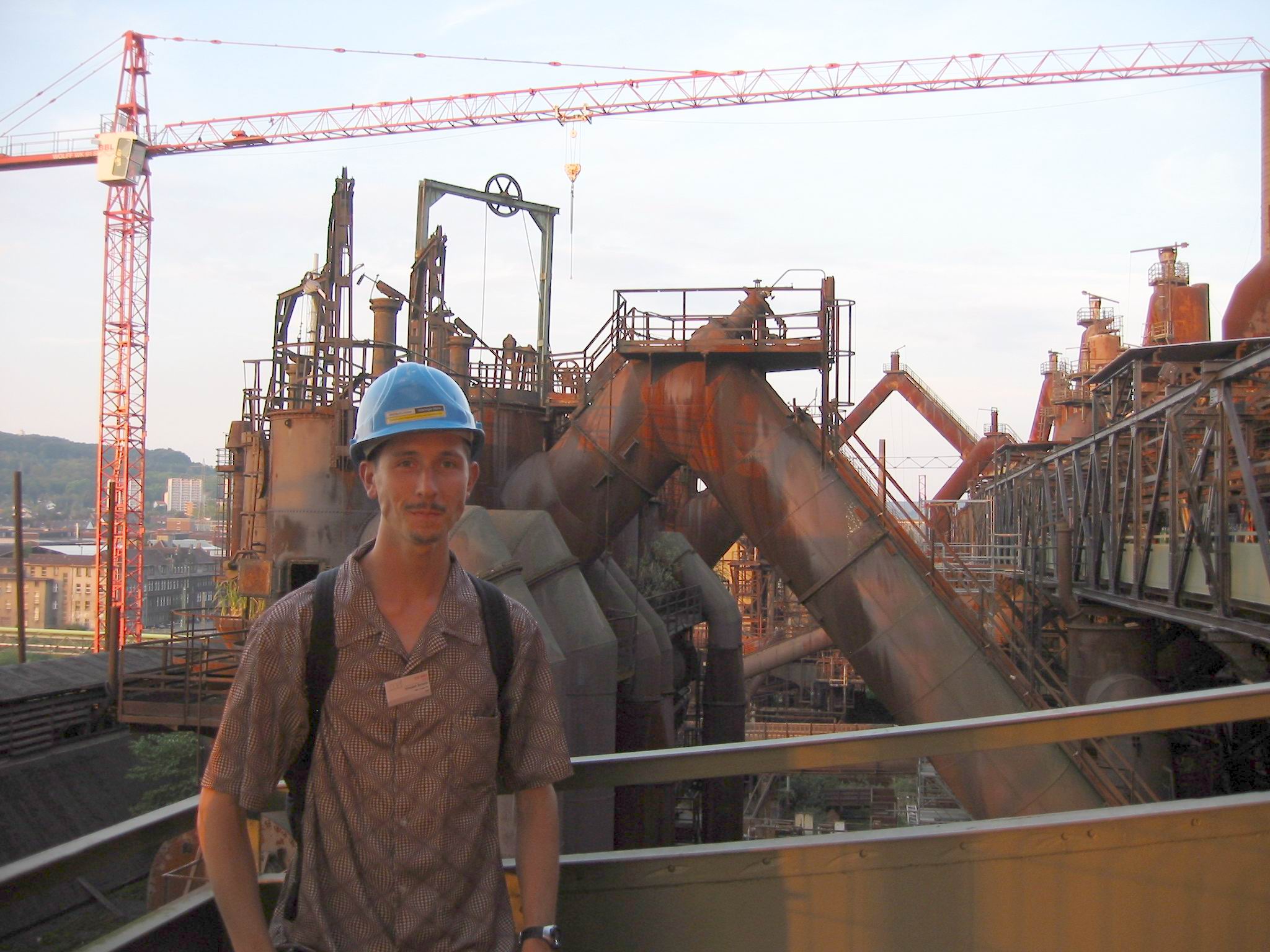 Vince wears a hard hat. These pipes are angled to avoid coal dust settling and accumulating