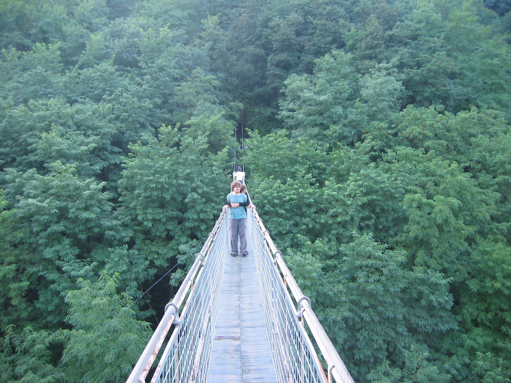 We also cross the cable suspension bridge, it is narrow. 